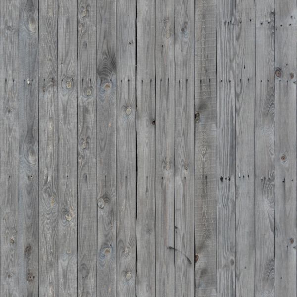 Thin grey planks installed evenly and vertically with dark streaks coming from nails.